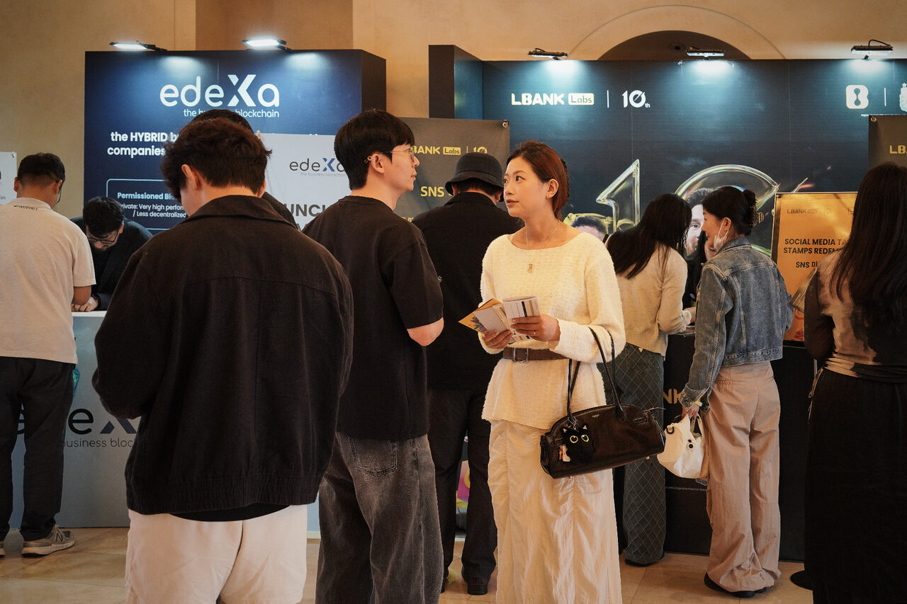 Visitors at the edeXa hybrid blockchain booth at LBank Labs 10th anniversary
