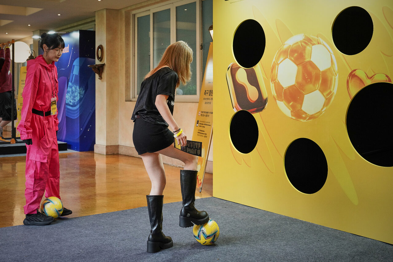 Attendee taking the edeXa Punch-In soccer challenge at the event